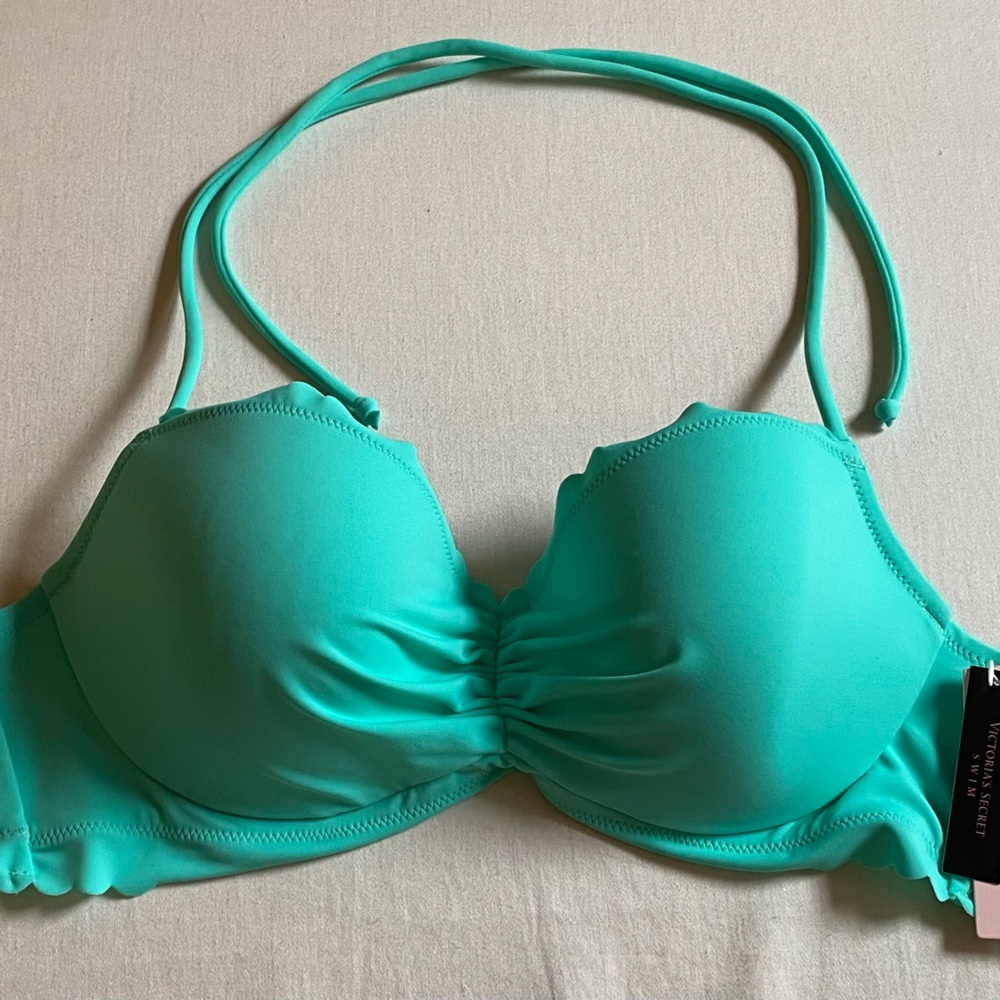 New w/ tags.‎ Victoria's Secret turquoise bikini top. Bottoms not included.